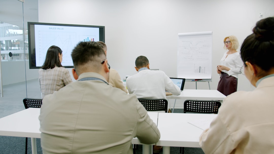 Business people in a modern conference room during a presentation.