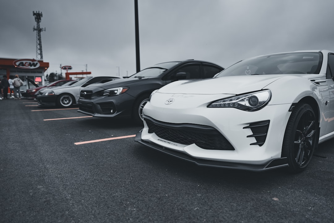 a group of cars parked in a parking lot