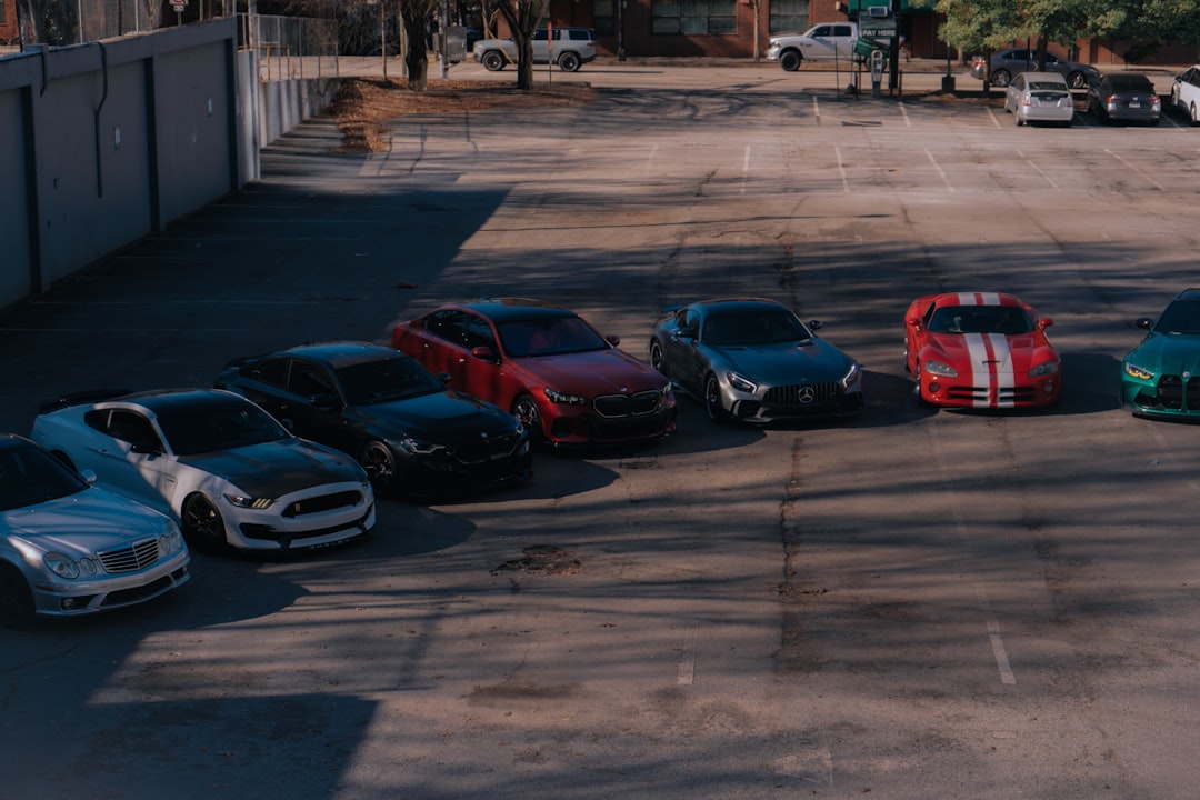 A group of cars parked in a parking lot