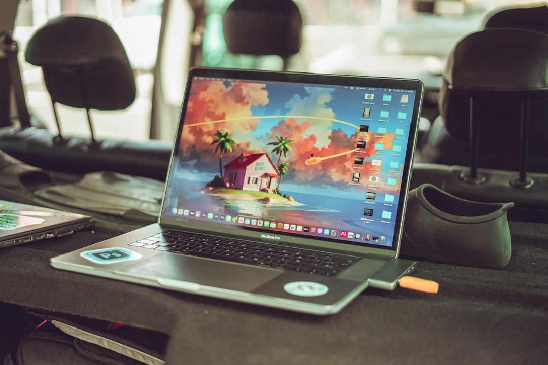 a laptop computer sitting on top of a table