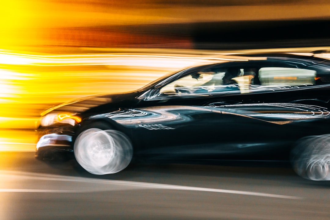 Black car speeding with motion blur effect