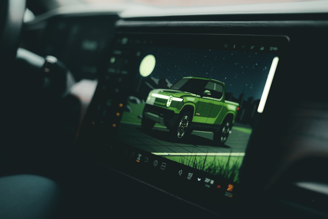 Green pickup truck displayed on car's infotainment screen