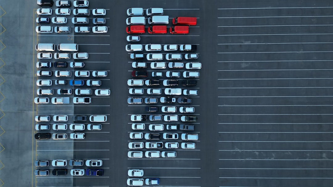 Aerial view of a parking lot filled with cars